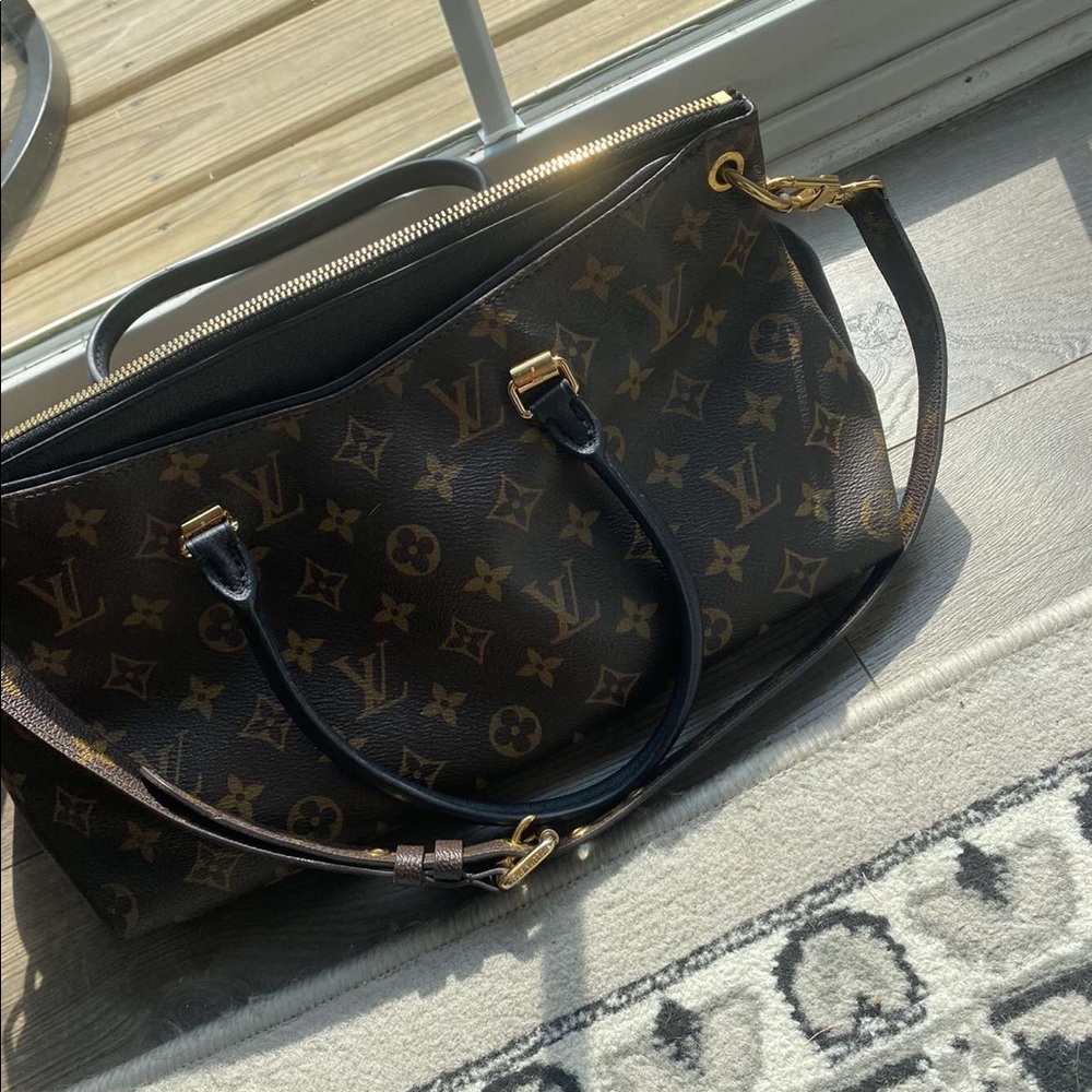 Woman’s Louis Vuitton purse